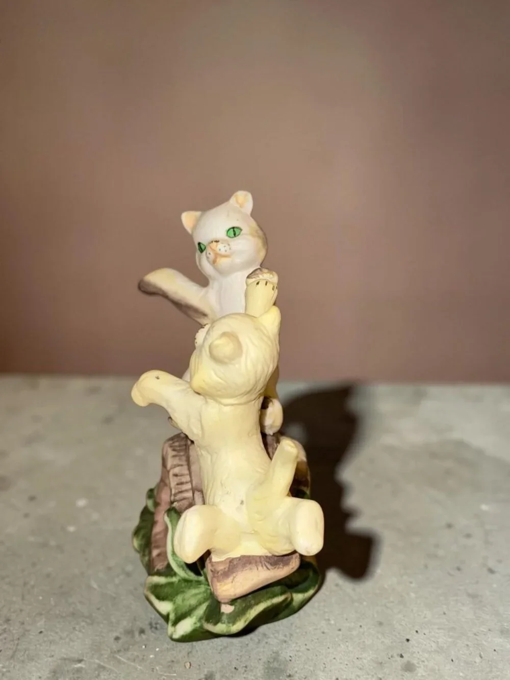 Vintage Ceramic Figurine Of Two Playful Cats On Log With Green Leaves